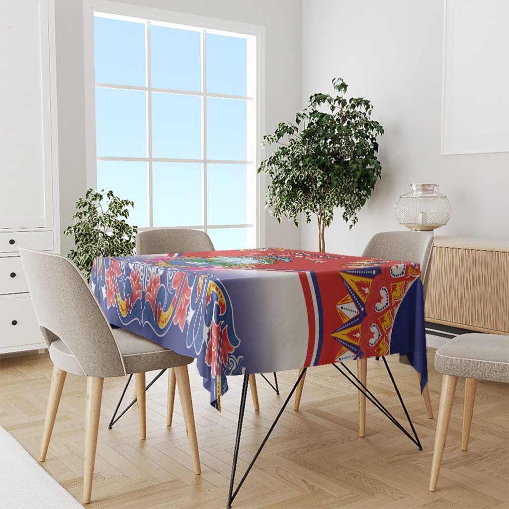 Red, blue, and white folk patterned tablecloth with multicolor border for dining tables