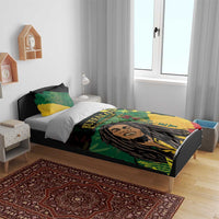Buffalo Soldier bedding set with green and yellow graphic duvet on bed and two pillowcases