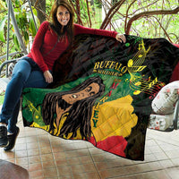Black quilt blanket on a patio sofa, with Buffalo Soldier portrait and multicolor musical notes.