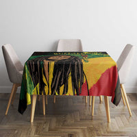 Black tablecloth with reggae portrait and colorful geometric artwork, centered on dining table