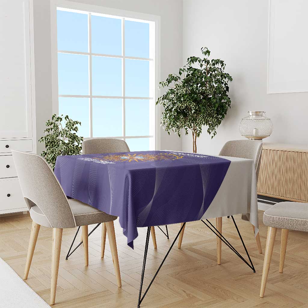 Purple Argentina football tablecloth draped over dining table with chairs