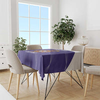 Purple Argentina football tablecloth draped over dining table with chairs