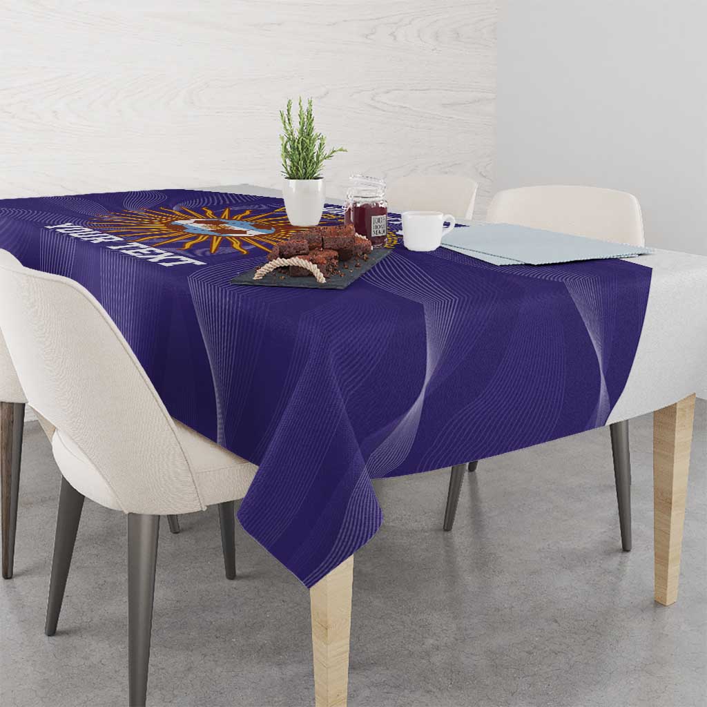 Purple tablecloth with Argentina sunburst ball graphic, draped over dining table