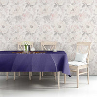 Purple Argentina-themed tablecloth with sunburst ball graphic laid across dining table