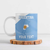 Blue ceramic football mug with Argentina map, sun emblem, and 'YOUR TEXT'