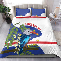 Cape Verde bedding set on bed: blue flag, red stripe, bird illustration with two matching pillows
