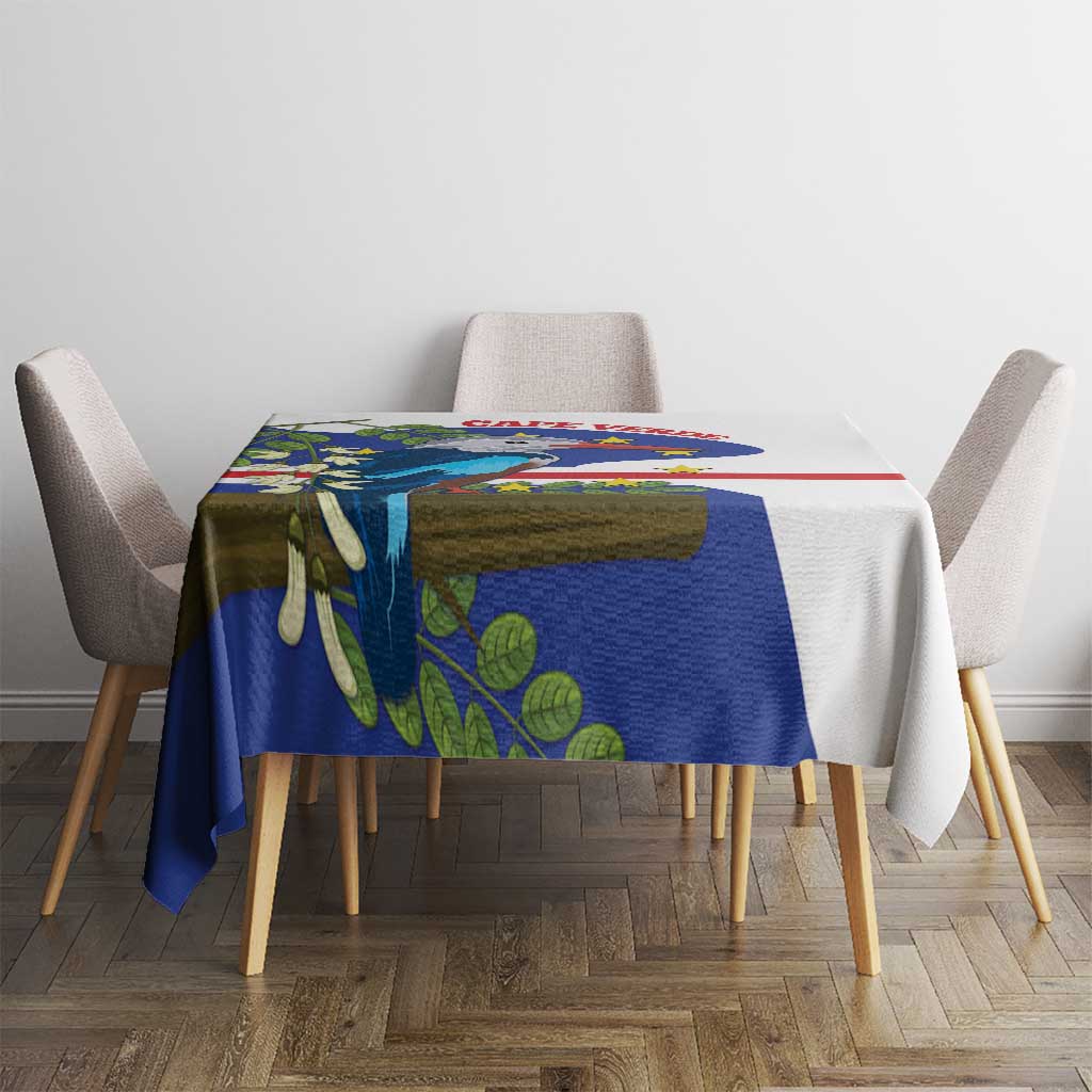 Small rectangular tablecloth with blue bird and leaf print and red stripe on table