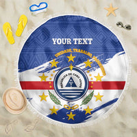Round beach blanket with Cabo Verde crest, blue white red stars, and white fringe edge