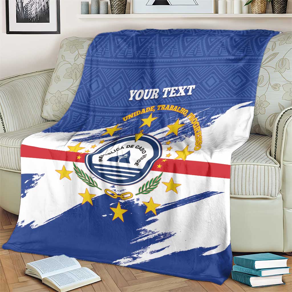 Cape Verde flag blanket draped with blue and white panels, red stripe, round emblem