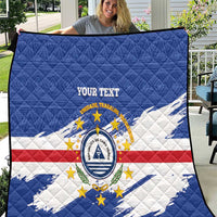 Quilted blanket with blue, red, white flag pattern, central crest, 'YOUR TEXT'.
