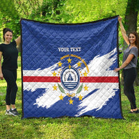 Oversized quilted blanket with blue flag colors and central crest, 'YOUR TEXT'.