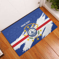 Blue doormat with Cape Verde crest, stars and stripes, and 'Your Text' banner.