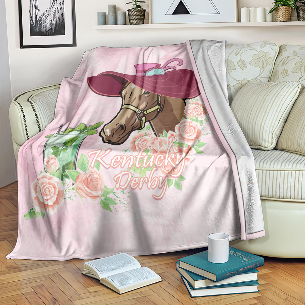 Pink horse racing blanket with rose border and Kentucky Derby print, draped on sofa