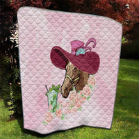 Pink quilt laid on lawn, horse head with red hat and roses bouquet print