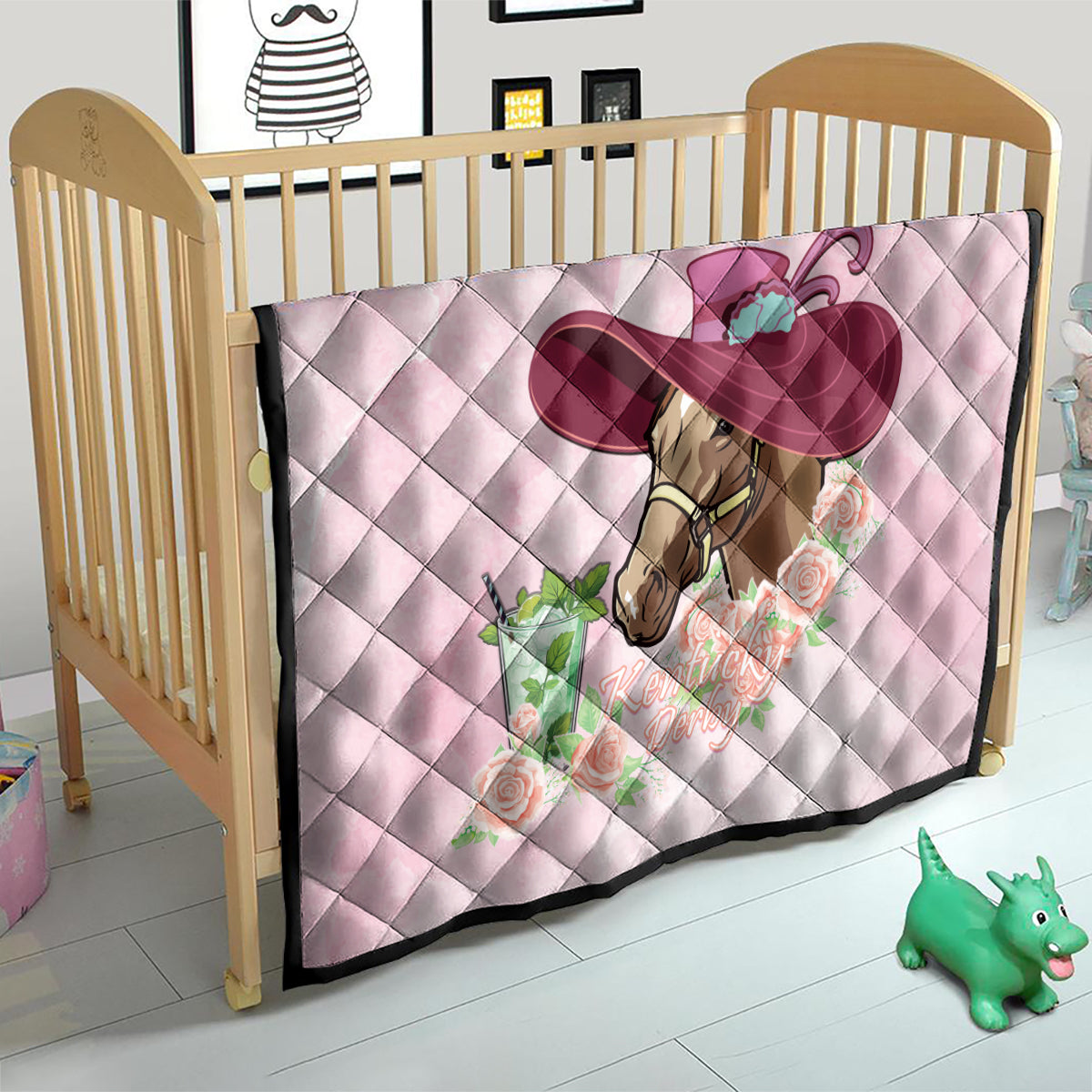 Pink quilt on crib, horse-and-roses design with large mint-julep style hat