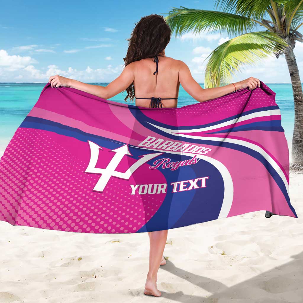 Pink cricket sarong wrap with Barbados Royals logo across the fabric