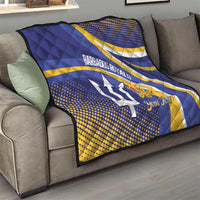 Blue and yellow Barbados Royals quilt draped over a sofa, with trident logo and custom text.