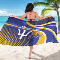 Cricket sarong worn, navy with yellow stripes, dotted trim, and team crest