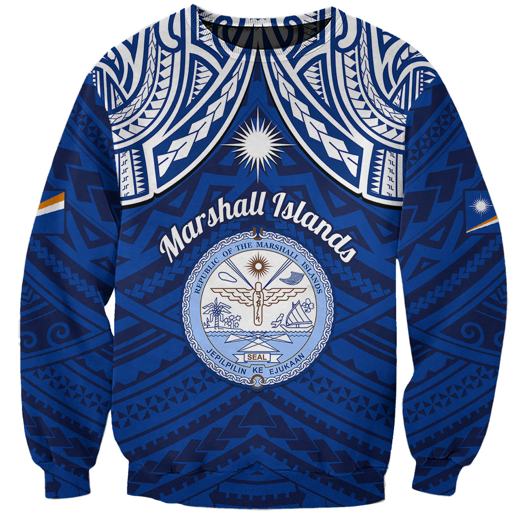 Blue sweatshirt with Polynesian tribal patterns and central crest graphic, crewneck