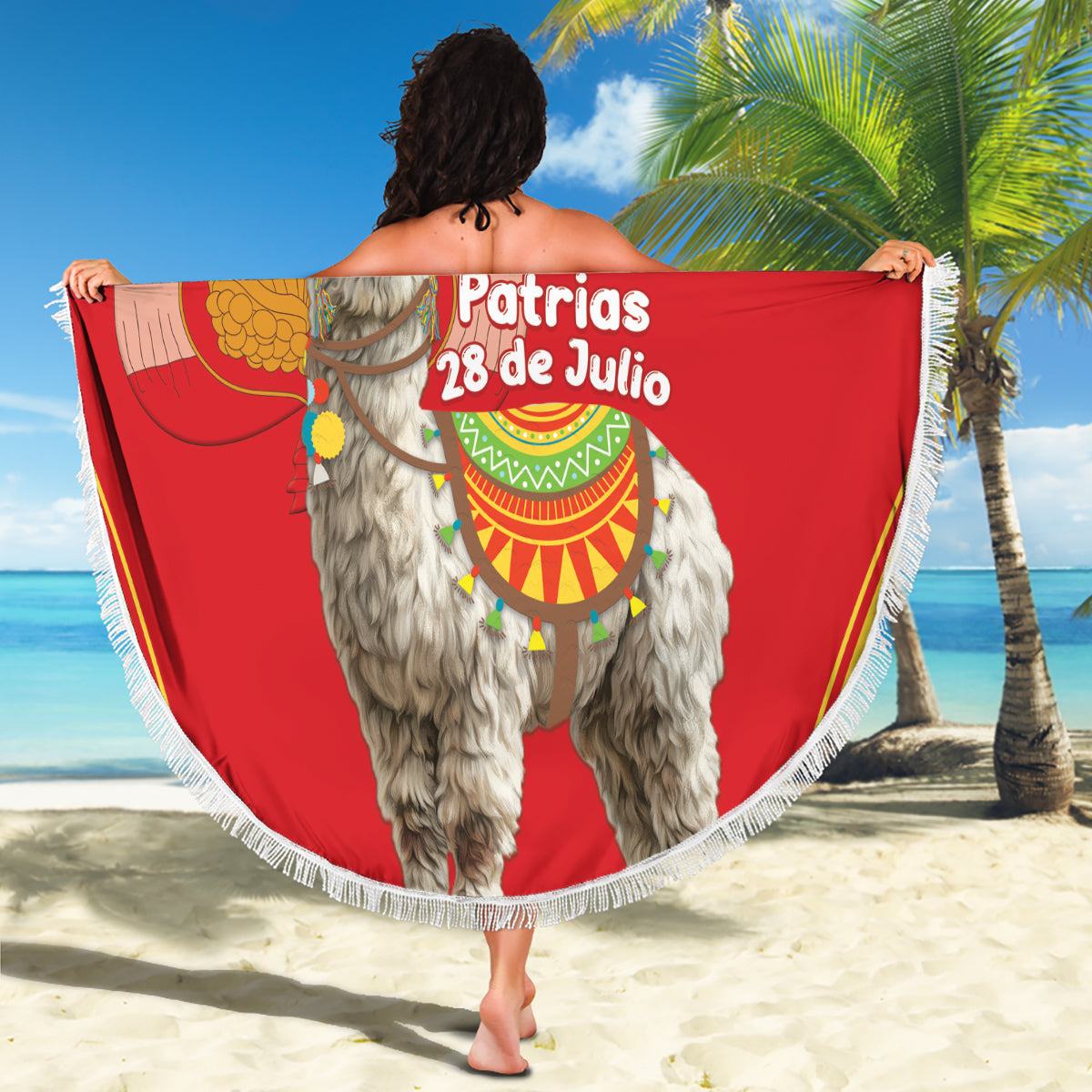 Red round beach blanket with white fringe, llama and festive Peru design, held outdoors
