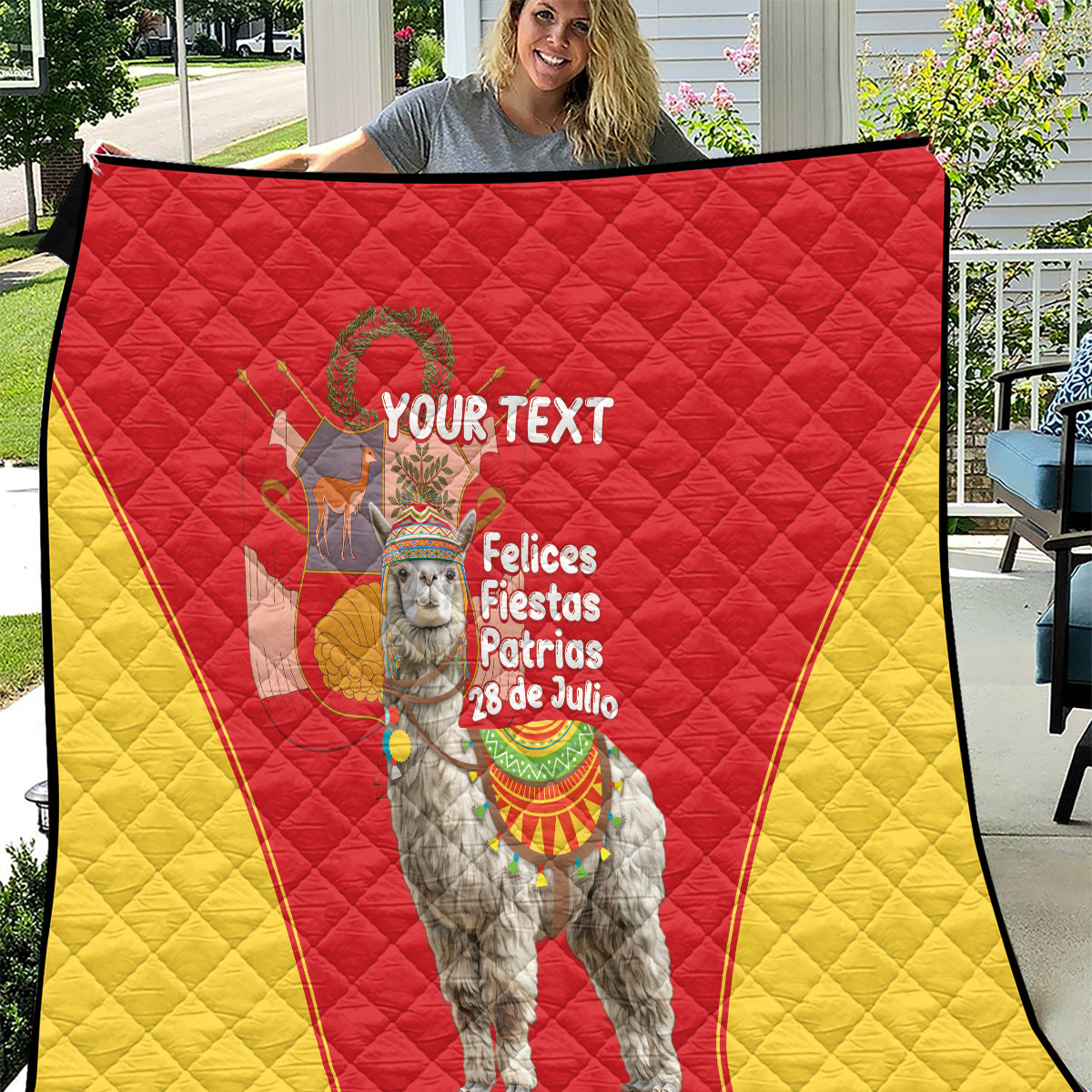 Oversized red-and-yellow quilt showing alpaca graphic, crest, and “Your Text” center.