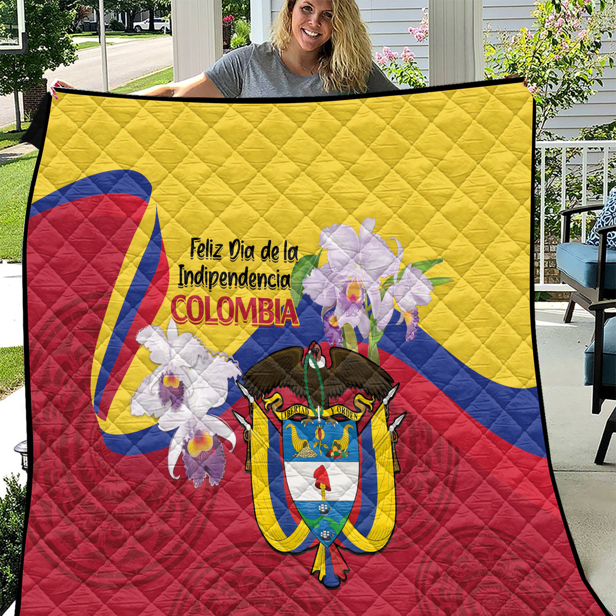 Colombia-themed quilt showing yellow top, red bottom, blue accents, and centered coat of arms