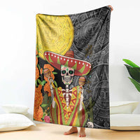 Dia de los Muertos blanket with black and gold skull, sombrero, and Aztec pattern art