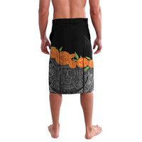 Black board shorts with centered skull face, gray ornate motifs, and orange flower hem