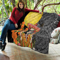 Black quilt on a seat with yellow moon, sugar skull sombrero, and orange marigold-like flowers