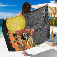 Black sarong spread out with yellow panel and sugar skull, ornate Aztec designs