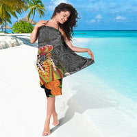 Black sarong with colorful sugar skull and Aztec motifs, draped on model