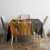 Black tablecloth laid across dining table with sombrero, skull, and Aztec pattern