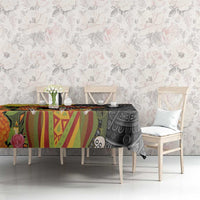 Black rectangular tablecloth with colorful skull and sombrero motif on sideboard table