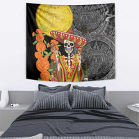 Black wall tapestry showing sugar skull in green-red sombrero, Aztec patterns, orange flowers