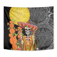 Black tapestry corner fold with golden sun medallion, sombrero skull, Aztec carvings