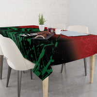 Kenya independence day tablecloth with green lion and red border over rectangular dining table.