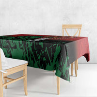Kenya independence day tablecloth, red and green graphic pattern, draped on table edge.