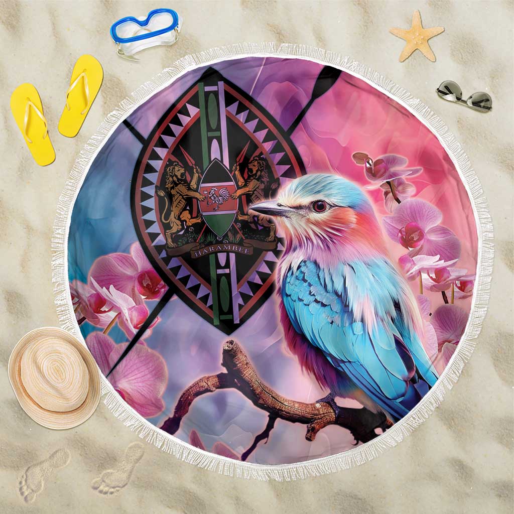 Round beach blanket with fringe, pink and purple, blue bird and coat-of-arms graphic