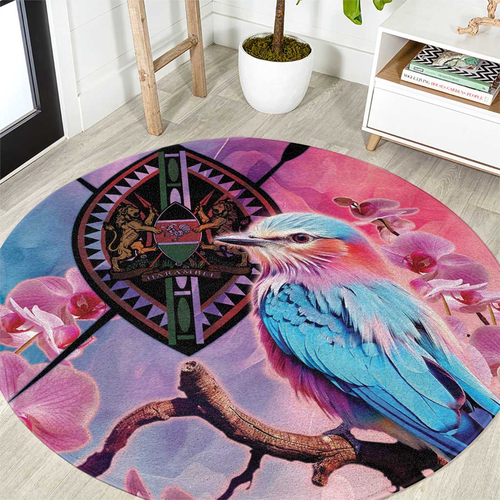 Round area rug with purple-pink bird print, circular emblem, and floral accents.