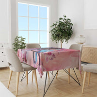 Rectangular pink orchid tablecloth draped over a dining table