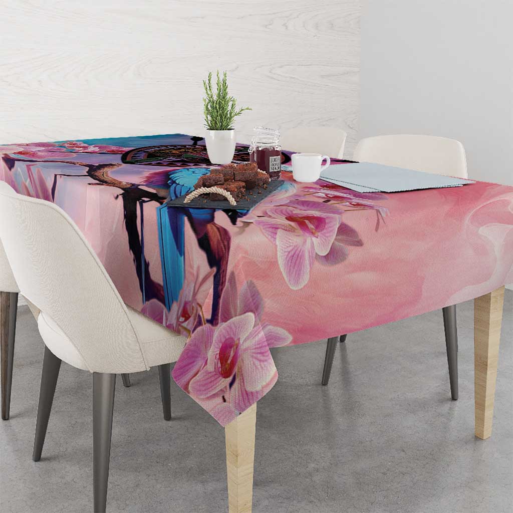 Pink floral tablecloth with orchid pattern and blue bird artwork