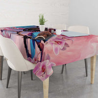 Pink floral tablecloth with orchid pattern and blue bird artwork