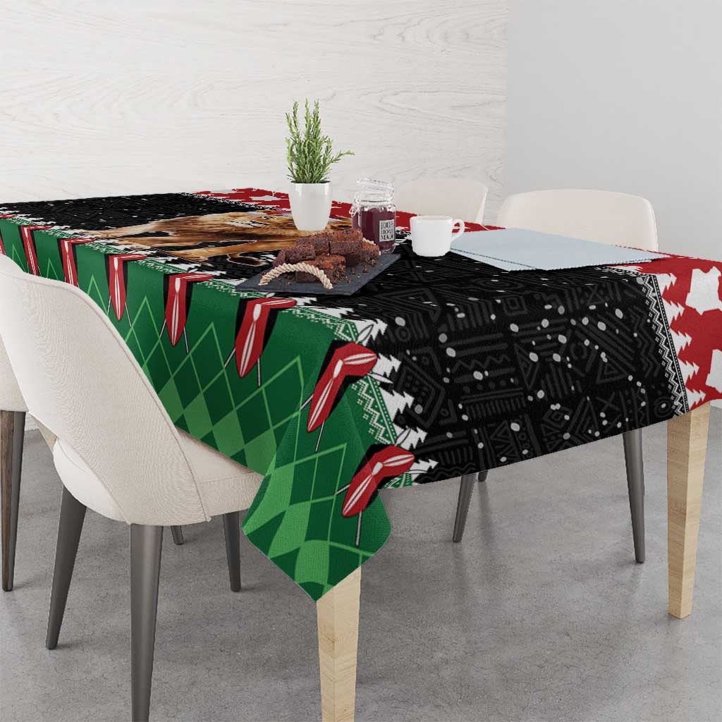 Christmas tablecloth showing lion Santa design on black and green patterned fabric.