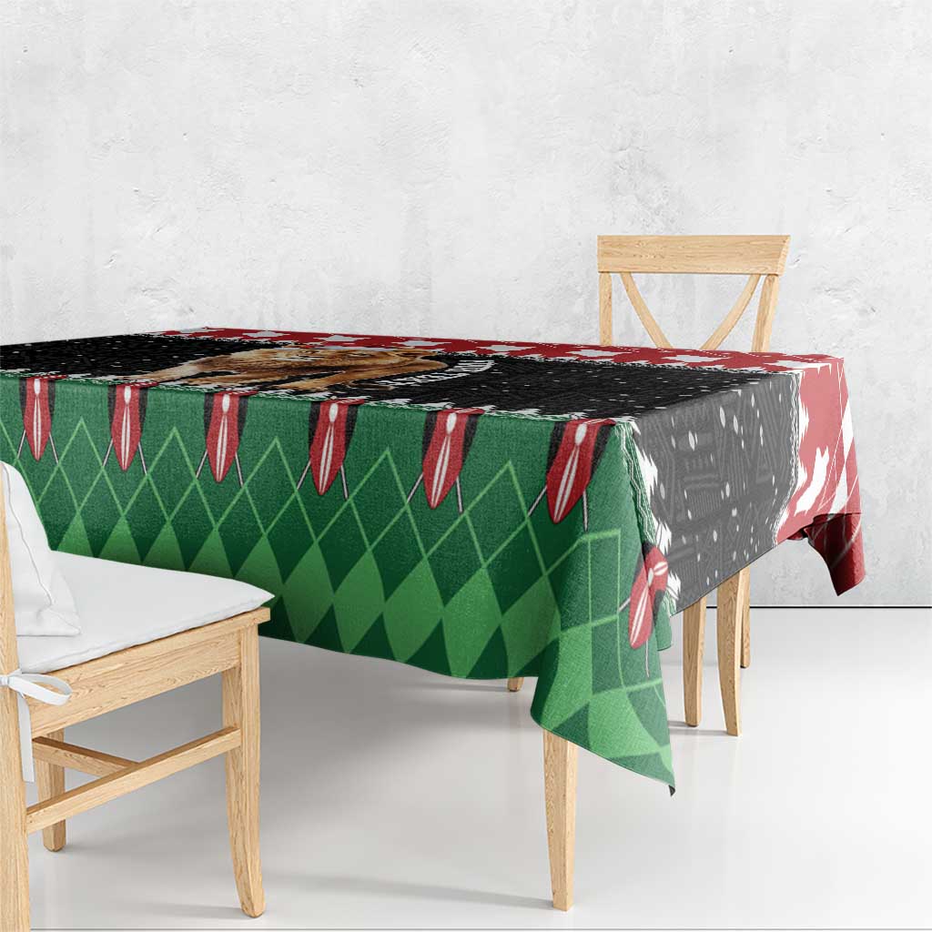 Christmas tablecloth with green diamond pattern and red white festive border.