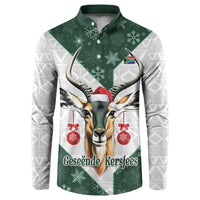 Green button-up sweatshirt with festive springbok graphic, snowflakes, and red ornaments