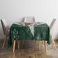 Green Christmas tablecloth with snowflake pattern and central deer graphic