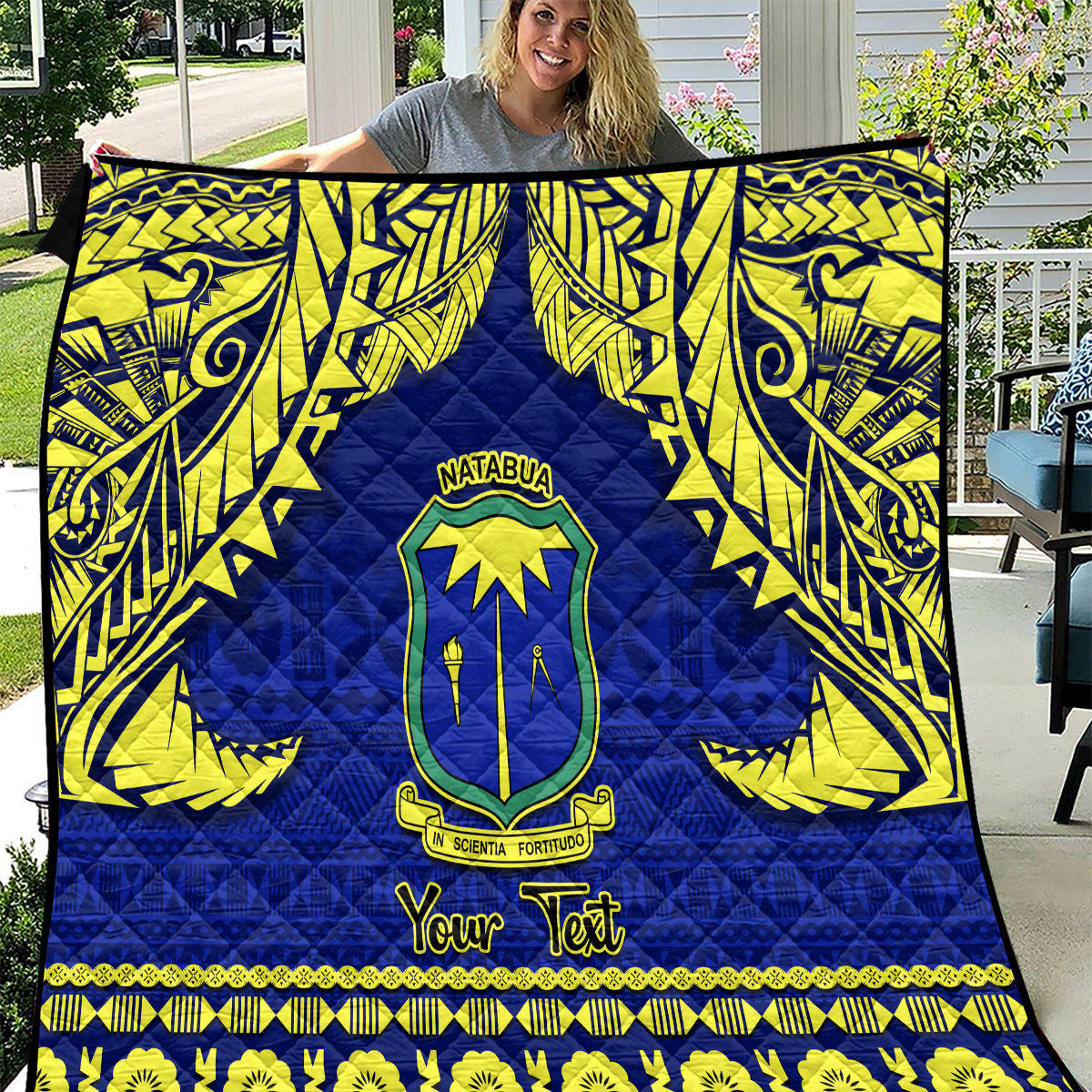 Blue quilt with yellow Fijian tapa pattern, school crest, and 'Your Text'.