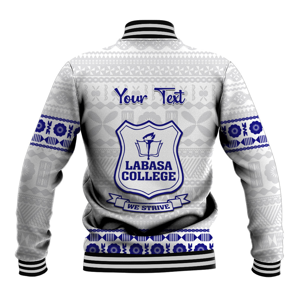 Unisex white baseball jacket back with tapa pattern, blue crest and text, ribbed hem and cuffs.
