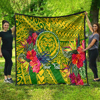 Green tropical quilt displayed outdoors with lion crest, hibiscus flowers, and geometric print