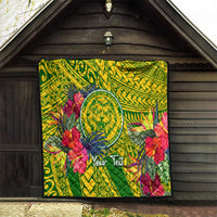 Green tropical quilt hanging on wall with lion crest, hibiscus flowers, and geometric pattern